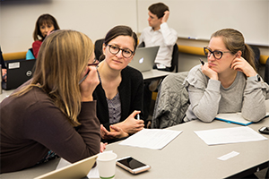 three women in discussion