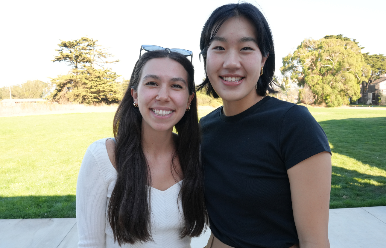 Two women standing outside