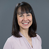 Headshot woman with short black hair