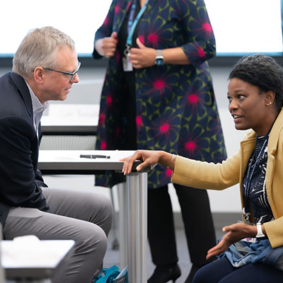 two people in conversation