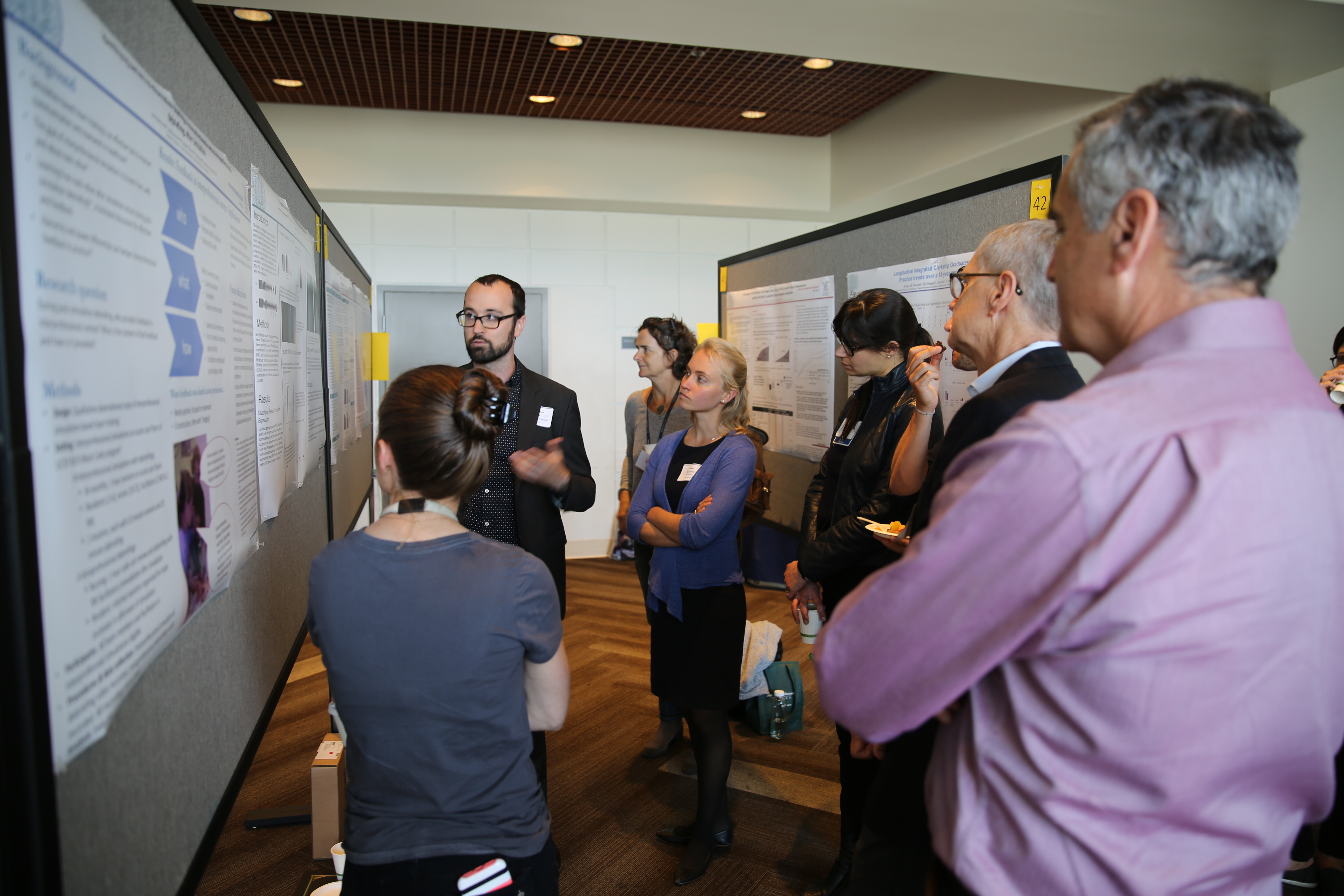 student presenting poster at Inquiry Symposium 2019
