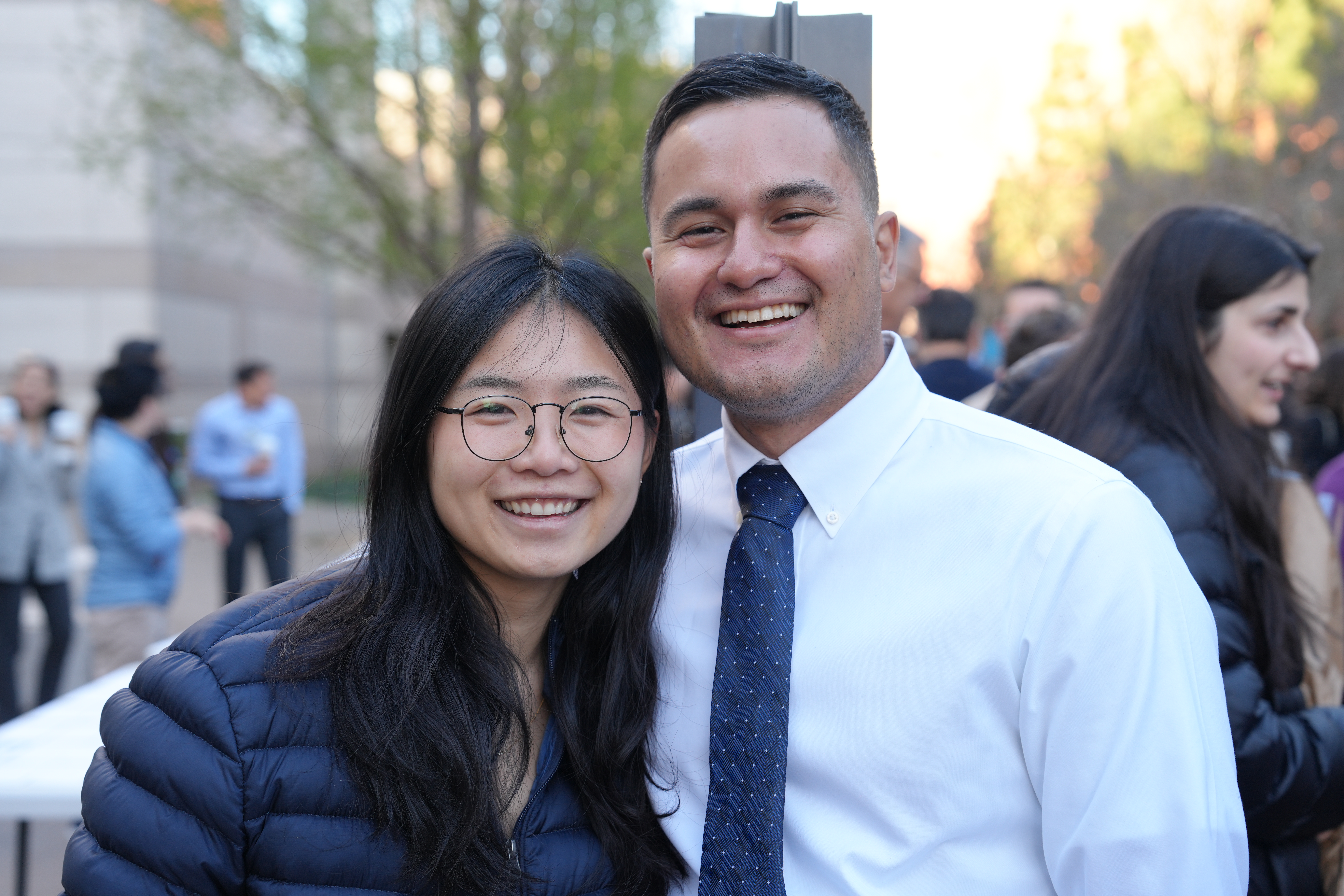 Two people standing outside