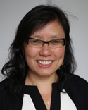 headshot asian women with medium black hair wearing eyeglasses