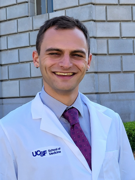 Man wearing white coat