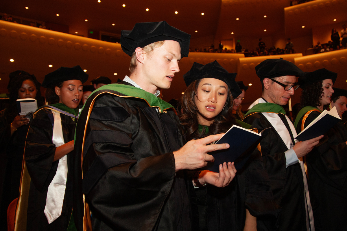 People wearing graduation gowns