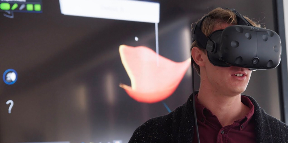 a student wearing a virtual reality headset provided by technology enhanced education
