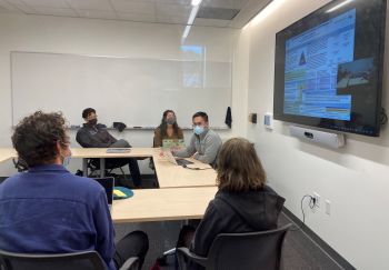 MS2, Harrison Tran, discusses his research during the Inquiry Summer Explore Poster Presentations