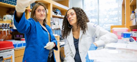 People looking at a sample at the lab.