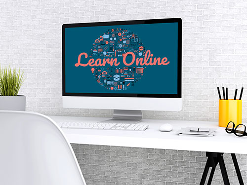 Laptop with "Learn Online" on screen